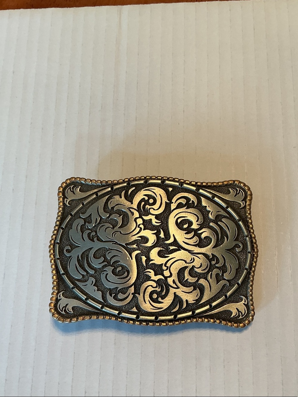 Vintage storming sterling silver belt buckle with floral engraved accents.